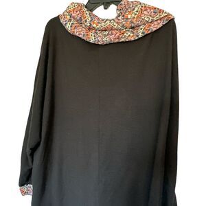 Yak & Yeti black tunic with a colorful collar and cuffs